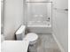 This modern bathroom showcases a clean, white interior with a combo tub and shower, toilet, and vanity at 154 Magenta Rose Dr, Raleigh, NC 27610