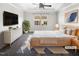 Serene bedroom featuring a large window, soft lighting, and ample closet space at 154 Magenta Rose Dr, Raleigh, NC 27610