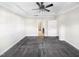 The primary bedroom features neutral walls, carpet flooring, a ceiling fan, and an ensuite bathroom at 154 Magenta Rose Dr, Raleigh, NC 27610