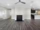 Open-concept living area with a fireplace and smooth transition to the kitchen area at 154 Magenta Rose Dr, Raleigh, NC 27610