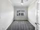 Bright office with neutral walls, carpet flooring, large windows, and white trim at 154 Magenta Rose Dr, Raleigh, NC 27610