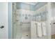 Luxurious walk-in shower with custom tile, shower head, and glass enclosure at 175 Stonecrest Way, Pittsboro, NC 27312