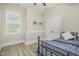 Cozy bedroom with wood-look floors, modern shutters, and comfortable, neutral decor at 175 Stonecrest Way, Pittsboro, NC 27312