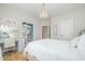 Bedroom with chandelier, desk, and ensuite bathroom at 175 Stonecrest Way, Pittsboro, NC 27312