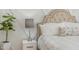 Tasteful bedroom showcasing a padded headboard and a charming lamp on the nightstand at 175 Stonecrest Way, Pittsboro, NC 27312
