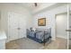 Comfortable bedroom featuring wood-look floors, stylish shiplap accent wall, and an inviting daybed at 175 Stonecrest Way, Pittsboro, NC 27312
