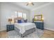 Well-lit bedroom featuring a classic design with blue and white decor at 175 Stonecrest Way, Pittsboro, NC 27312