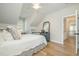 Comfortable bedroom with wood floors and dormer window at 175 Stonecrest Way, Pittsboro, NC 27312