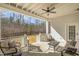 Covered porch features outdoor seating, ceiling fan and overlooks a sprawling lawn at 175 Stonecrest Way, Pittsboro, NC 27312