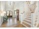 Grand foyer with high ceilings, staircase, and wood floors at 175 Stonecrest Way, Pittsboro, NC 27312