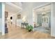 Inviting foyer with hardwood floors, elegant decor, and a glimpse into the formal dining room at 175 Stonecrest Way, Pittsboro, NC 27312