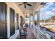 A long, cozy front porch with rocking chairs and a brick floor at 175 Stonecrest Way, Pittsboro, NC 27312