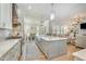 Spacious kitchen with island and views of the dining and living spaces at 175 Stonecrest Way, Pittsboro, NC 27312