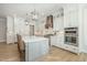 Gourmet kitchen with stainless steel appliances, custom cabinets, and a center island at 175 Stonecrest Way, Pittsboro, NC 27312