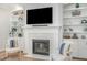 Living room features a fireplace with built-in shelves and stylish decor at 175 Stonecrest Way, Pittsboro, NC 27312