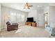 Spacious living room with plush seating, natural light and ceiling fan at 175 Stonecrest Way, Pittsboro, NC 27312