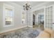 Sun-lit living room boasts hardwood floors and an open layout with views of the outdoors at 175 Stonecrest Way, Pittsboro, NC 27312