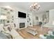 Cozy living room with fireplace, built-in bookshelves, and hardwood floors at 175 Stonecrest Way, Pittsboro, NC 27312