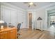 Office space with a desk, a view of the hallway, and large closets for storage at 175 Stonecrest Way, Pittsboro, NC 27312
