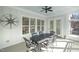 Relaxing screened-in porch with ceiling fan and a dining table and chairs at 175 Stonecrest Way, Pittsboro, NC 27312