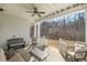Comfortable covered patio featuring a ceiling fan and stylish outdoor seating at 175 Stonecrest Way, Pittsboro, NC 27312