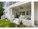 Covered porch of home with ceiling fan and seating at 175 Stonecrest Way, Pittsboro, NC 27312