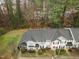 Aerial view showcasing a townhome community with well-maintained landscaping, sidewalks, and ample parking spaces at 2268 Plum Frost Dr, Raleigh, NC 27603