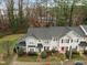 Aerial view showcasing a townhome community with well-maintained landscaping, sidewalks, and ample parking spaces at 2268 Plum Frost Dr, Raleigh, NC 27603