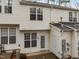 Exterior view featuring a back patio area, white siding, and multiple windows providing ample natural light at 2268 Plum Frost Dr, Raleigh, NC 27603