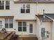 Exterior view featuring a back patio area, white siding, and multiple windows providing ample natural light at 2268 Plum Frost Dr, Raleigh, NC 27603