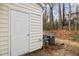 The backyard features a storage shed, lush foliage, an HVAC unit, and a privacy fence at 2268 Plum Frost Dr, Raleigh, NC 27603