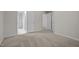 Bedroom featuring neutral carpet, a closet, and access to other rooms in the home at 2268 Plum Frost Dr, Raleigh, NC 27603