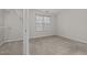 Bright bedroom has neutral carpet, a closet, and a window providing natural light at 2268 Plum Frost Dr, Raleigh, NC 27603