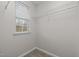 Walk-in closet with metal shelving and bright window that provides natural light at 2268 Plum Frost Dr, Raleigh, NC 27603
