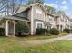 Charming townhome with a covered porch, manicured shrubs, and sidewalk access, perfect for a welcoming curb appeal at 2268 Plum Frost Dr, Raleigh, NC 27603