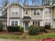 Inviting townhome with neat landscaping, a blue front door, and a well-maintained exterior at 2268 Plum Frost Dr, Raleigh, NC 27603