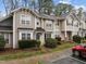 Charming townhome showcasing a well-manicured lawn, mature shrubs, and a classic siding exterior at 2268 Plum Frost Dr, Raleigh, NC 27603