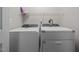 Laundry room with modern, front-load washing machine and dryer at 2268 Plum Frost Dr, Raleigh, NC 27603