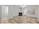 Living room with fireplace and luxury vinyl plank flooring and a ceiling fan at 2268 Plum Frost Dr, Raleigh, NC 27603