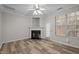 The living room features a fireplace, neutral walls, and hardwood floors at 2268 Plum Frost Dr, Raleigh, NC 27603