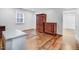 Bedroom with hardwood floors, natural light, and traditional wood furniture offers both comfort and style at 2502 Devils Racetrack Rd, Four Oaks, NC 27524