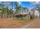 Cozy home exterior with tidy landscaping, natural light, and inviting curb appeal at 2502 Devils Racetrack Rd, Four Oaks, NC 27524