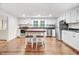 Modern kitchen featuring stainless steel appliances, island with stools, and ample cabinetry at 2502 Devils Racetrack Rd, Four Oaks, NC 27524