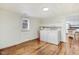Laundry room with outdoor access, wood floors, and plenty of room for appliances offers comfort and style at 2502 Devils Racetrack Rd, Four Oaks, NC 27524
