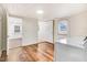 Bright laundry room with direct outdoor access and hardwood floors blends functionality with design at 2502 Devils Racetrack Rd, Four Oaks, NC 27524