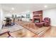 Bright living space with wood floors, fireplace, and open access to the kitchen at 2502 Devils Racetrack Rd, Four Oaks, NC 27524