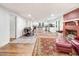 Open-concept living space with wood floors, fireplace, and ample natural light at 2502 Devils Racetrack Rd, Four Oaks, NC 27524