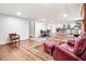 Spacious living area with wood floors, fireplace, and seamlessly connected to the kitchen at 2502 Devils Racetrack Rd, Four Oaks, NC 27524