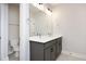 Bathroom featuring dual sinks, large mirror and view to the toilet and shower at 264 Big Bradley Dr, Wendell, NC 27591