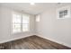 Cozy bedroom with wood floors, large windows, and ample natural light at 264 Big Bradley Dr, Wendell, NC 27591